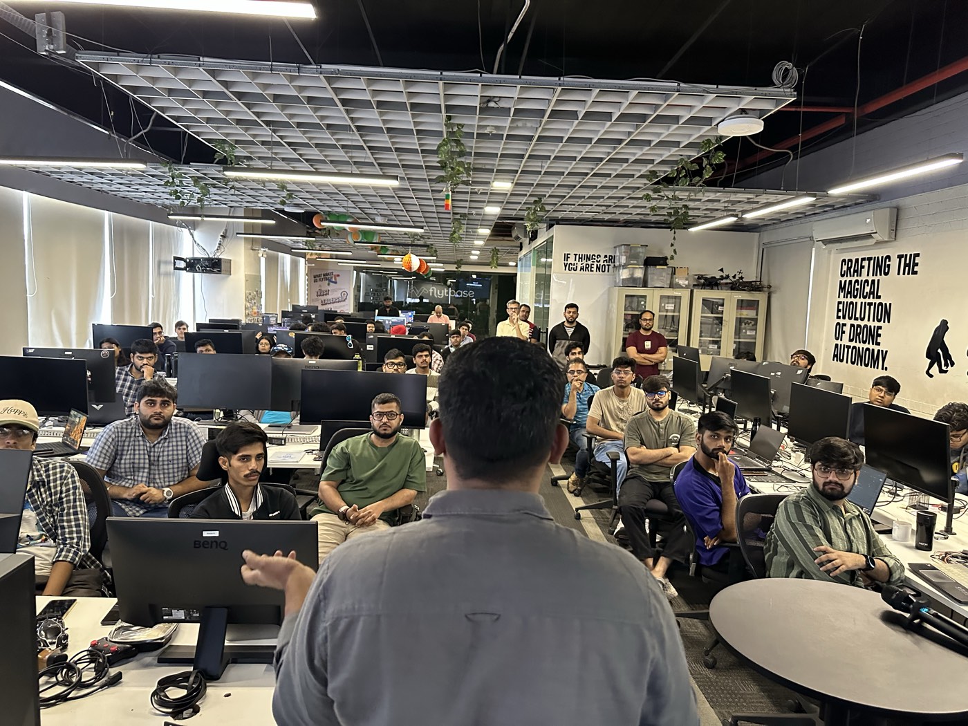 Speaker presenting at an AI Hackers Collective demo day